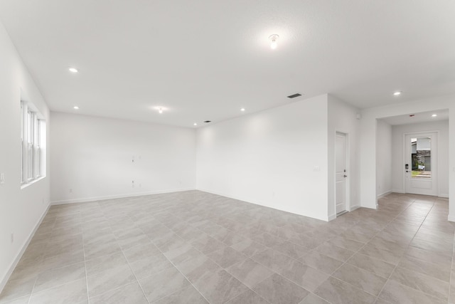 14408 SW Ellison Dr, Port Saint Lucie, FL 34987 - unfurnished room featuring recessed lighting, baseboards, and light tile patterned floors