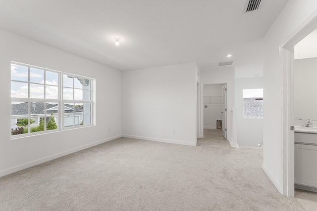 14408 SW Ellison Dr, Port Saint Lucie, FL 34987 - unfurnished room with light carpet, a sink, and baseboards