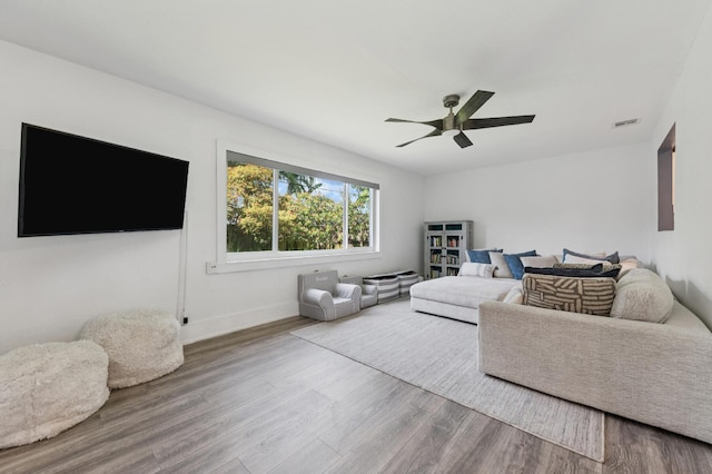 1056 SW 27th Ave, Boynton Beach, FL 33426 - living room featuring wood finished floors, ceiling fan, and baseboards