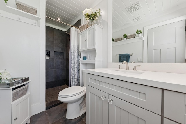1056 SW 27th Ave, Boynton Beach, FL 33426 - bathroom with vanity, a tile shower, toilet, and tile patterned floors