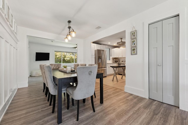 1056 SW 27th Ave, Boynton Beach, FL 33426 - dining space with light wood-style floors, baseboards, and recessed lighting