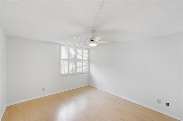 1950 SW Palm City Rd Unit 5109, Stuart, FL 34994 - spare room featuring ceiling fan, light wood-type flooring, and a textured ceiling