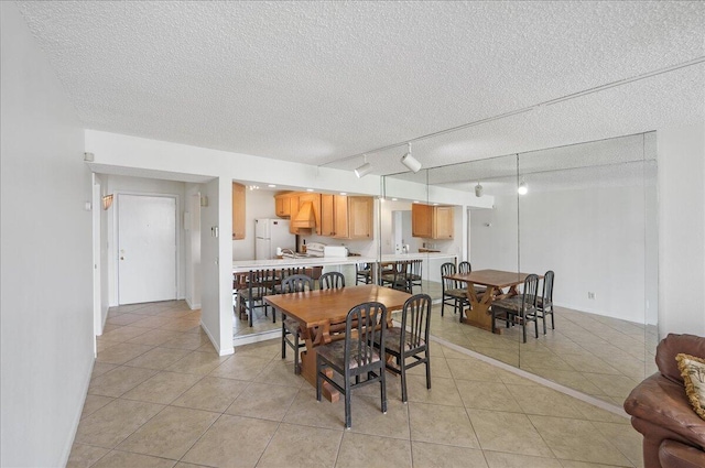 1950 SW Palm City Rd Unit 5109, Stuart, FL 34994 - dining room featuring track lighting, a textured ceiling, and light tile patterned flooring