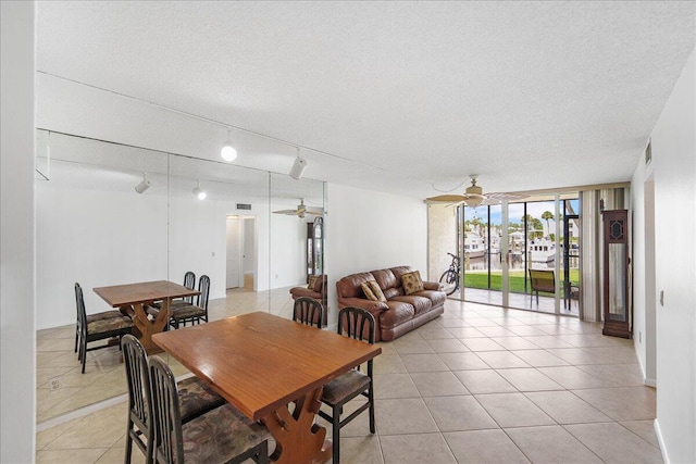 1950 SW Palm City Rd Unit 5109, Stuart, FL 34994 - dining space featuring ceiling fan, light tile patterned floors, and a textured ceiling