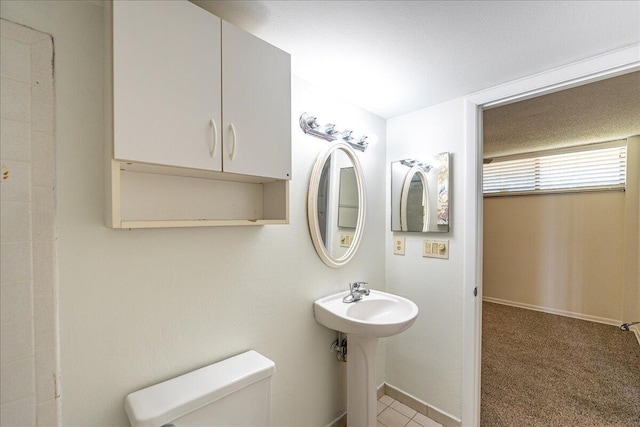 1950 SW Palm City Rd Unit 5109, Stuart, FL 34994 - bathroom featuring toilet and baseboards