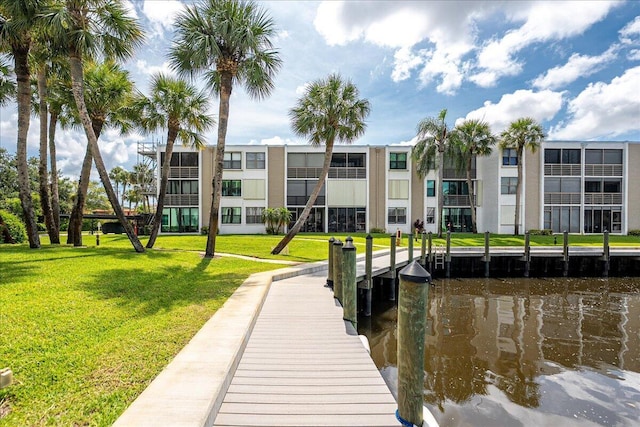 1950 SW Palm City Rd Unit 5109, Stuart, FL 34994 - dock featuring a water view and a yard