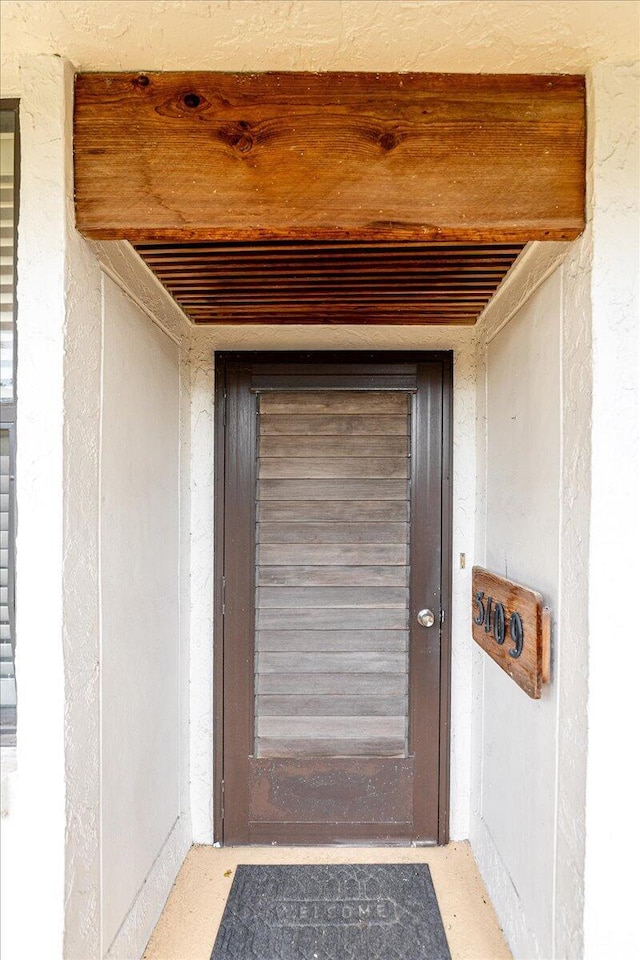 1950 SW Palm City Rd Unit 5109, Stuart, FL 34994 - view of exterior entry featuring stucco siding