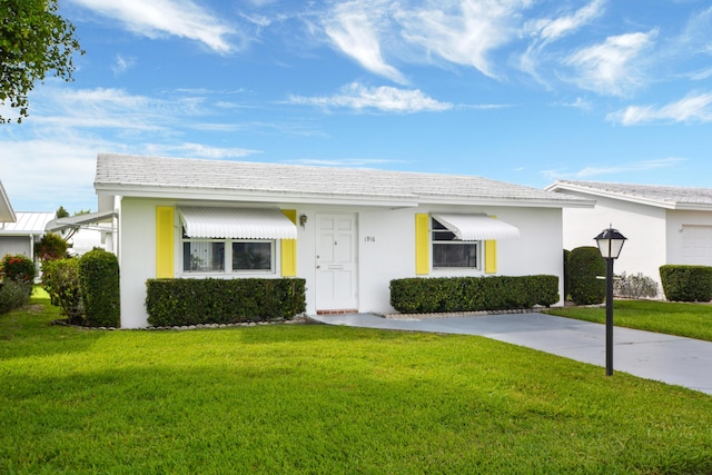 1916 SW 19th St, Boynton Beach, FL 33426 - view of front of property featuring a front lawn and stucco siding