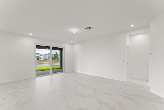 14483 SW Woodford Way, Port Saint Lucie, FL 34987 - unfurnished room with light marble finish flooring, baseboards, recessed lighting, and a water view