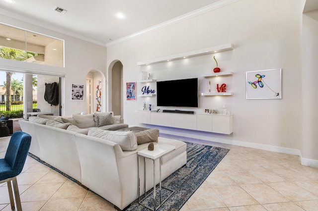 16414 Braeburn Ridge Trl, Delray Beach, FL 33446 - living area with light tile patterned floors, arched walkways, a high ceiling, ornamental molding, and recessed lighting