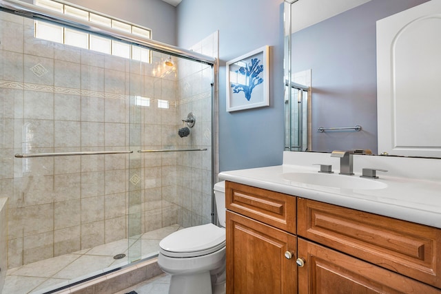 16414 Braeburn Ridge Trl, Delray Beach, FL 33446 - full bathroom featuring toilet, vanity, a shower stall, and tile patterned floors