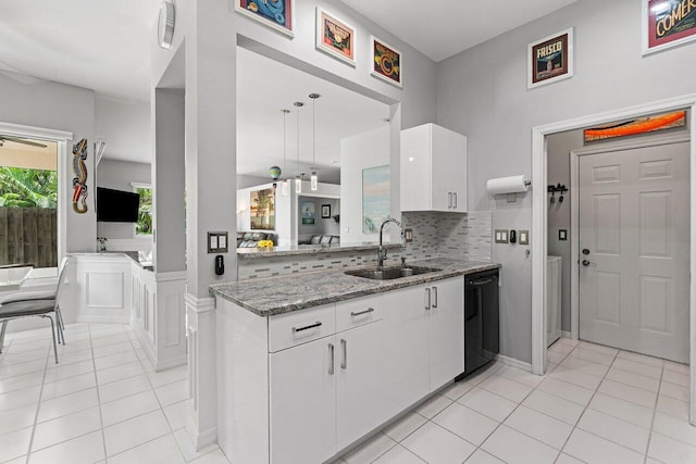 137 N Lakeshore Dr, Hypoluxo, FL 33462 - kitchen featuring a sink, black dishwasher, white cabinets, and light tile patterned floors