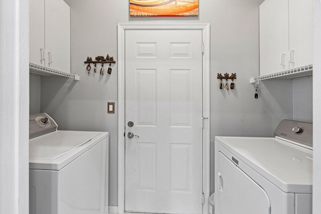137 N Lakeshore Dr, Hypoluxo, FL 33462 - washroom featuring washer and dryer and cabinet space