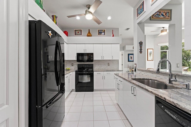137 N Lakeshore Dr, Hypoluxo, FL 33462 - kitchen with black appliances, a ceiling fan, a sink, backsplash, and light tile patterned flooring