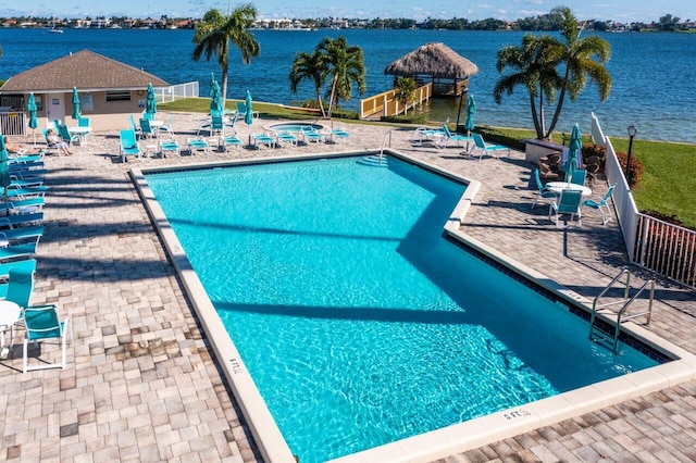 137 N Lakeshore Dr, Hypoluxo, FL 33462 - community pool with a patio and a water view