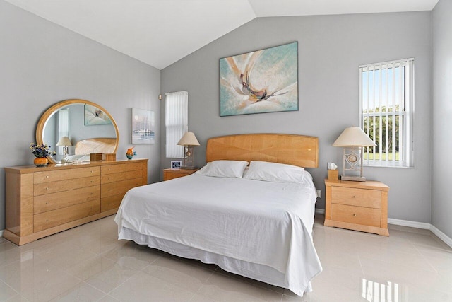 137 N Lakeshore Dr, Hypoluxo, FL 33462 - bedroom featuring lofted ceiling, tile patterned floors, and baseboards