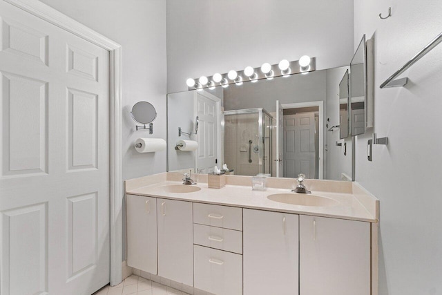 137 N Lakeshore Dr, Hypoluxo, FL 33462 - bathroom with a stall shower, double vanity, and tile patterned flooring