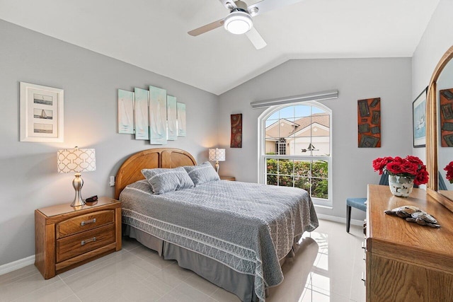 137 N Lakeshore Dr, Hypoluxo, FL 33462 - bedroom with lofted ceiling, baseboards, light tile patterned floors, and a ceiling fan