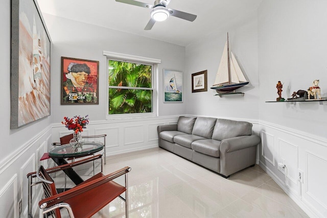 137 N Lakeshore Dr, Hypoluxo, FL 33462 - living area with a decorative wall, wainscoting, ceiling fan, and tile patterned floors