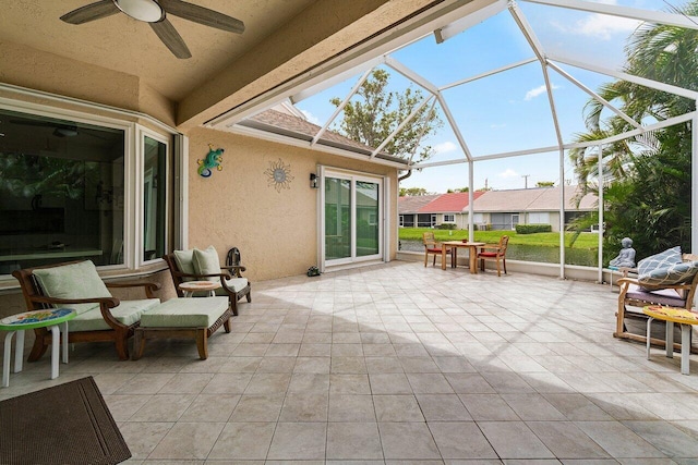 137 N Lakeshore Dr, Hypoluxo, FL 33462 - view of patio featuring a ceiling fan and glass enclosure