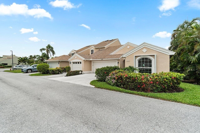 137 N Lakeshore Dr, Hypoluxo, FL 33462 - multi unit property featuring driveway, stucco siding, and a garage