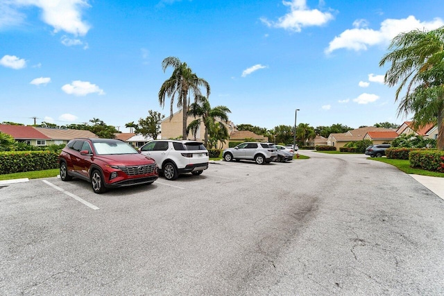 137 N Lakeshore Dr, Hypoluxo, FL 33462 - view of asphalt road featuring a residential view and street lighting