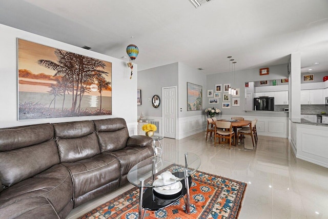 137 N Lakeshore Dr, Hypoluxo, FL 33462 - living area featuring a wainscoted wall