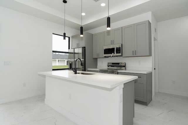 4209 25th St SW, Lehigh Acres, FL 33976 - kitchen with appliances with stainless steel finishes, a sink, gray cabinetry, light marble finish floors, and baseboards