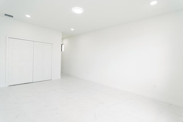 4209 25th St SW, Lehigh Acres, FL 33976 - unfurnished bedroom featuring recessed lighting and a closet