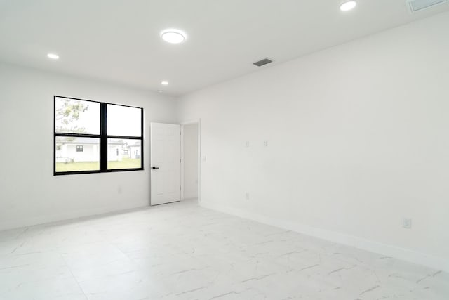 4209 25th St SW, Lehigh Acres, FL 33976 - empty room with recessed lighting, baseboards, and light marble finish floors