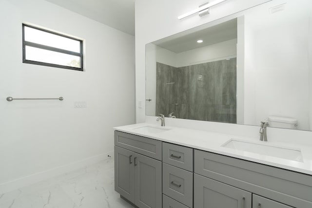 4209 25th St SW, Lehigh Acres, FL 33976 - full bath featuring marble look tile flooring, double vanity, baseboards, a shower, and toilet