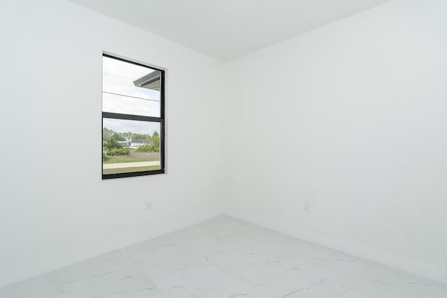 4209 25th St SW, Lehigh Acres, FL 33976 - unfurnished room featuring baseboards and light marble finish floors