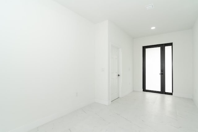 4209 25th St SW, Lehigh Acres, FL 33976 - spare room with light marble finish flooring, baseboards, and recessed lighting