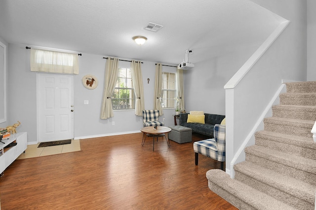 2186 SE Destin Dr, Port Saint Lucie, FL 34952 - entryway with stairway, wood finished floors, and baseboards