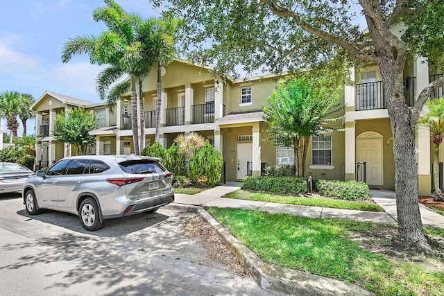 2186 SE Destin Dr, Port Saint Lucie, FL 34952 - view of property featuring stucco siding