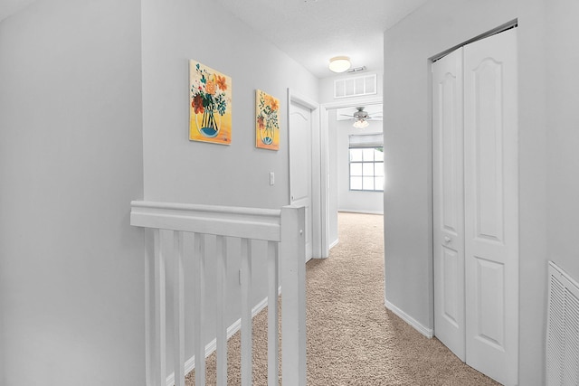 2186 SE Destin Dr, Port Saint Lucie, FL 34952 - hallway featuring light colored carpet and baseboards