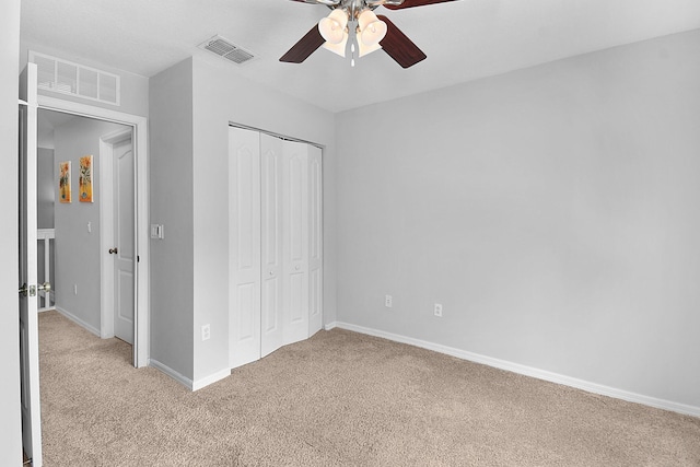 2186 SE Destin Dr, Port Saint Lucie, FL 34952 - unfurnished bedroom featuring light colored carpet, a closet, baseboards, and ceiling fan