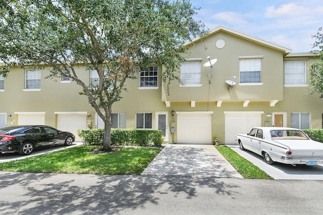 2186 SE Destin Dr, Port Saint Lucie, FL 34952 - multi unit property with a garage, driveway, and stucco siding