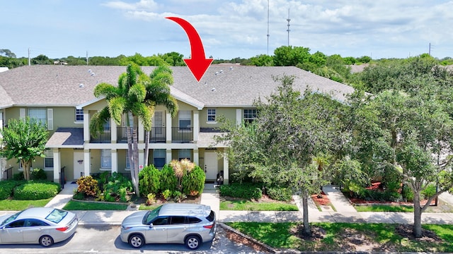 2186 SE Destin Dr, Port Saint Lucie, FL 34952 - multi unit property with stucco siding, a shingled roof, and uncovered parking