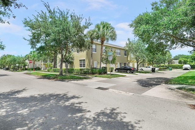 2186 SE Destin Dr, Port Saint Lucie, FL 34952 - view of front facade with stucco siding and a residential view