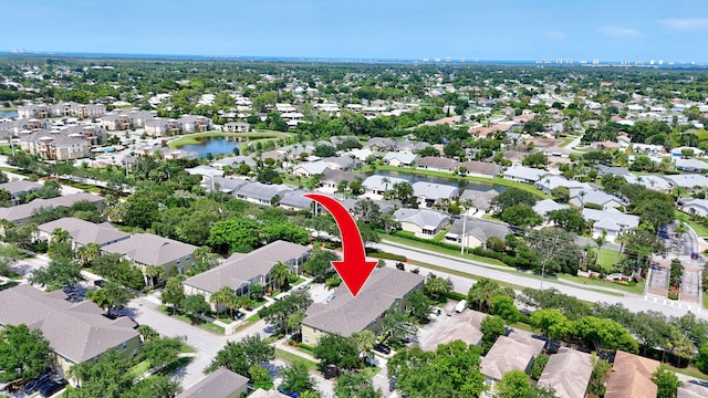 2186 SE Destin Dr, Port Saint Lucie, FL 34952 - aerial view of property and surrounding area with nearby suburban area and a nearby body of water