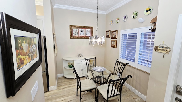 9587 Weldon Cir Unit B414, Tamarac, FL 33321 - dining room featuring light wood-style flooring, crown molding, a textured ceiling, baseboards, and a chandelier