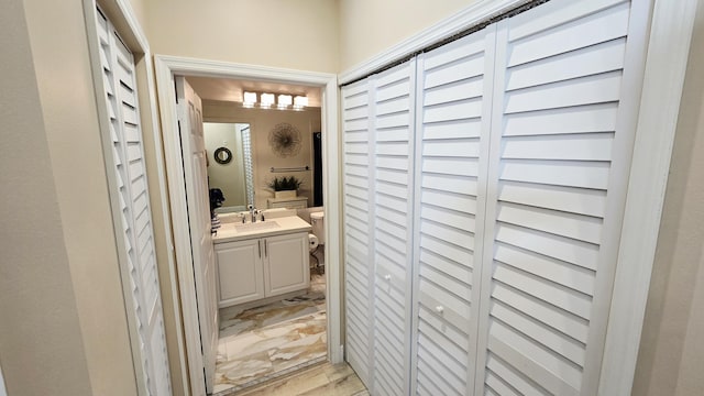 9587 Weldon Cir Unit B414, Tamarac, FL 33321 - bathroom featuring a closet, vanity, and toilet