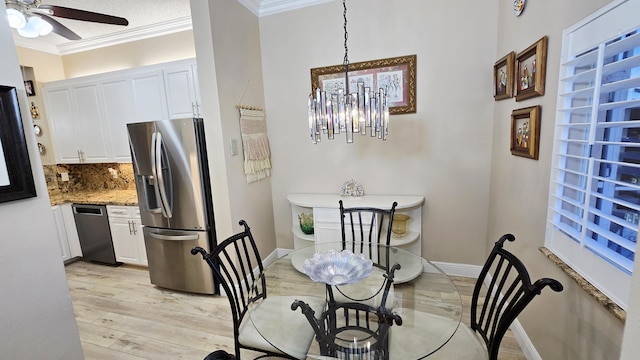 9587 Weldon Cir Unit B414, Tamarac, FL 33321 - dining room featuring crown molding, a ceiling fan, light wood finished floors, baseboards, and a chandelier