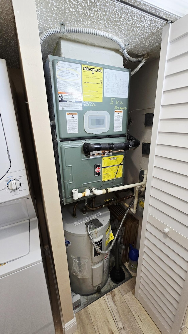 9587 Weldon Cir Unit B414, Tamarac, FL 33321 - utilities with stacked washer and clothes dryer