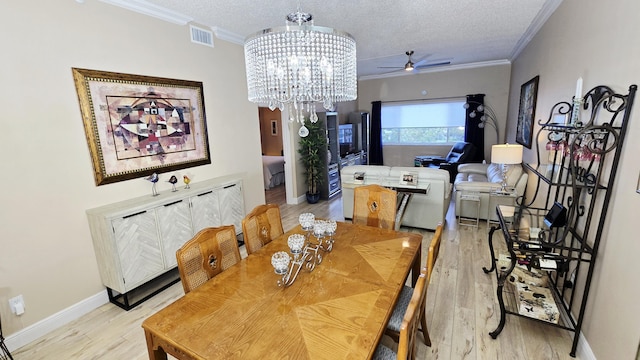 9587 Weldon Cir Unit B414, Tamarac, FL 33321 - dining space featuring a ceiling fan, light wood-style floors, a chandelier, crown molding, and baseboards