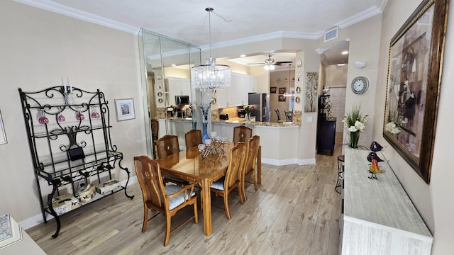 9587 Weldon Cir Unit B414, Tamarac, FL 33321 - dining space with ornamental molding, light wood-style floors, ceiling fan, a chandelier, and baseboards