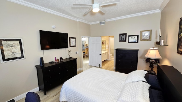 9587 Weldon Cir Unit B414, Tamarac, FL 33321 - bedroom featuring light wood-style flooring, a textured ceiling, crown molding, baseboards, and ensuite bath