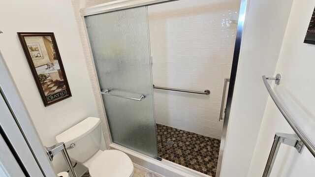 9587 Weldon Cir Unit B414, Tamarac, FL 33321 - bathroom with toilet and a shower stall
