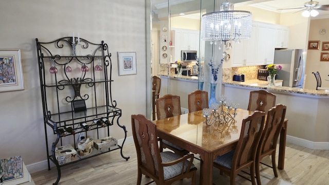 9587 Weldon Cir Unit B414, Tamarac, FL 33321 - dining space featuring light wood-style flooring and baseboards
